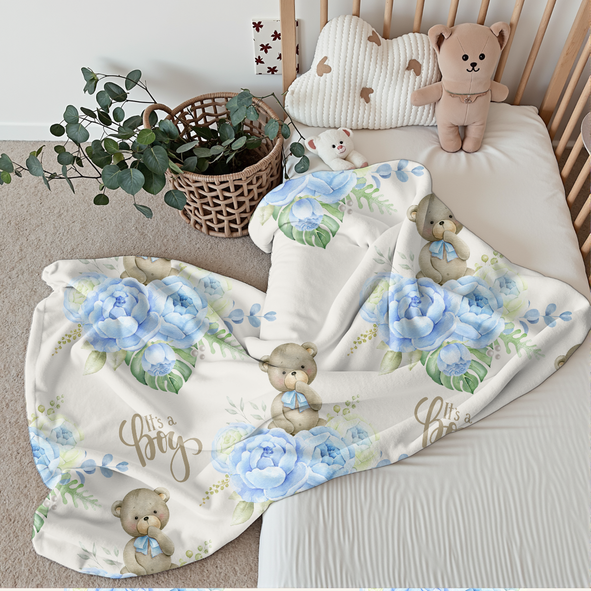 Babydecke it`s a boy liegt auf Babybett